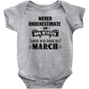 never underestimate an old man who was born in march Baby Onesie
