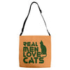real men love cats, funny quote Adjustable Strap Totes