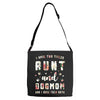 i have two titles aunt and dogmom and i rock them both with roses Adjustable Strap Totes