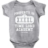 property of tla Baby Onesie