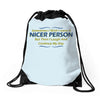 nicer person Drawstring Bags