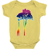 giraffe reaching up with its long neck to eat leaves off branches from Baby Onesie