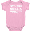 installing muscles funny Baby Onesie