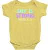 she is strong Baby Bodysuit