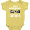 never underestimate an old man who was born in october Baby Onesie