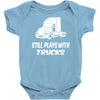 still plays with trucks Baby Onesie