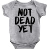 not dead yet Baby Onesie
