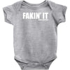 fakin' it Baby Onesie