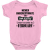 never underestimate an old man who was born in february Baby Onesie
