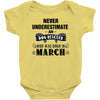 never underestimate an old man who was born in march Baby Onesie