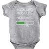 installing muscles please wait Baby Onesie