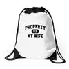 property of my wife Drawstring Bags