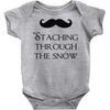 staching through the snow Baby Onesie