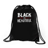 black is beautiful Drawstring Bags
